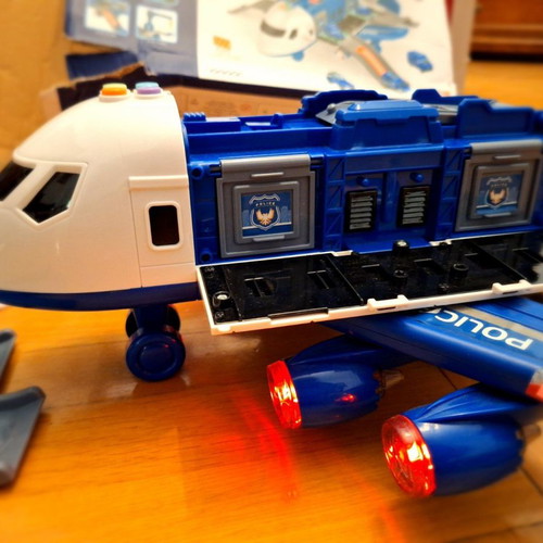 Airplane toy used with lights and sounds, transforms into station
