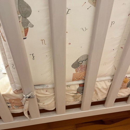 Baby cot like new with unused bedding set and cot bumper