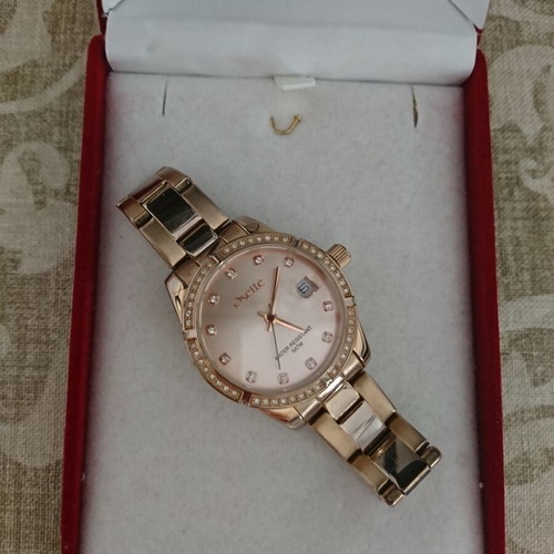 Oxette women's waterproof quartz watch with pink gold stainless steel bracelet and rhinestone bezel like new