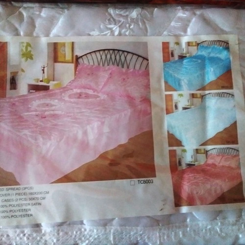 Satin quilt new, white, double bed with two large pillowcases and embossed machine embroidery