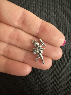Metal silver Cupid charm like new for jewelry and crafts