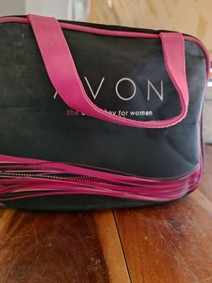 Avon cosmetic bag used, black and pink, collector's edition