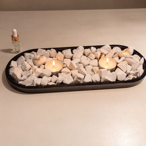 Handmade plaster chips with LED tealights in black tray