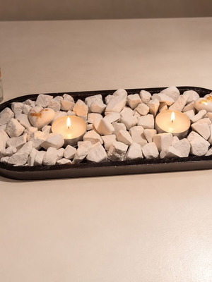 Handmade plaster chips with LED tealights in black tray