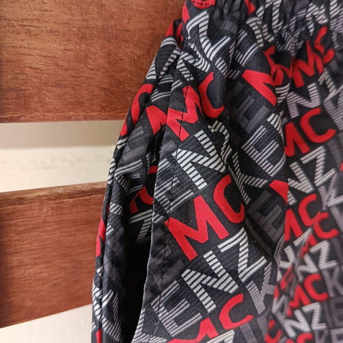 McKenzie Shorts Swimwear new, black with red print, size 12-13 years