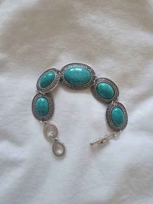 Faux metal bracelet with turquoise stones like new