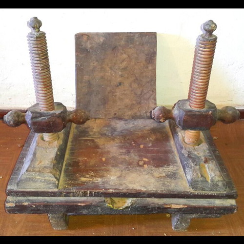 Vintage bookbinding press used with screw pressure mechanism