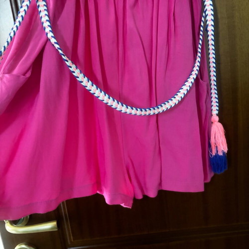 Pink one-piece shorts like new with belt size M