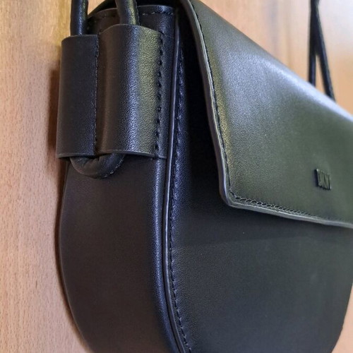 Dkny black leather crossbody bag like new with knot design strap