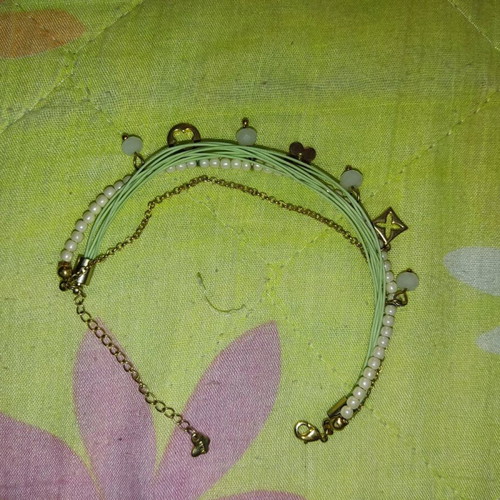 Bracelet used with hanging charms, cord, pearl and chain
