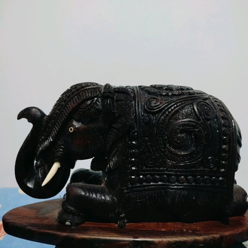 Wooden handmade elephant with carved details like new