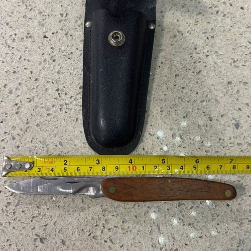 Folding knife used from 1980s with sheath