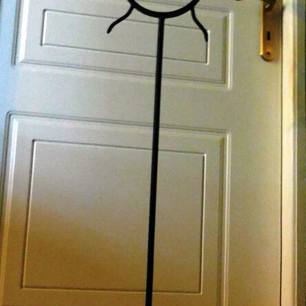 Metal floor candle holder like new with 3 bases, sun design