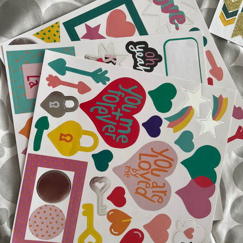 Scrapbooking kit used with stickers and decorative papers