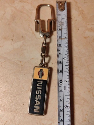 Vintage Nissan keychain used, good condition