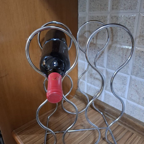 Metal Wine Rack like new, wave design, holds 6 bottles