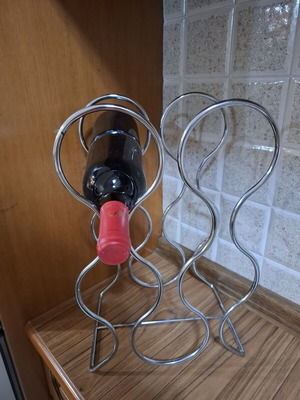 Metal Wine Rack like new, wave design, holds 6 bottles