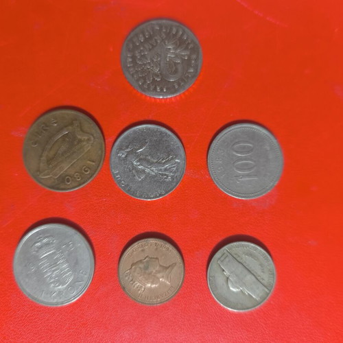 Collection of 7 used foreign coins with various dates and denominations