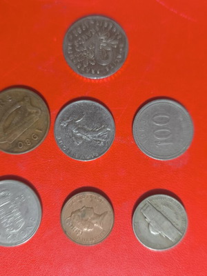 Collection of 7 used foreign coins with various dates and denominations
