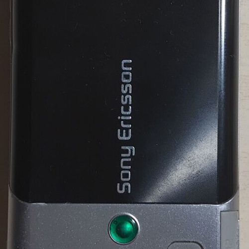 Sony Ericsson T700 phone used with charger and Memory Stick Micro