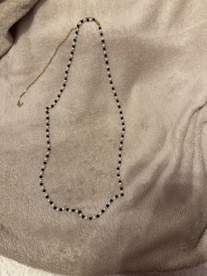 Necklace new with white and black stones and gold chain