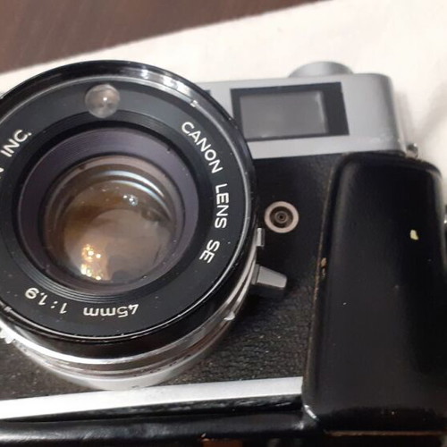 Canon Canonet QL19 camera used with flash and extra lens