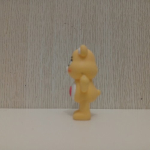 Care Bears Yellow Love-A-Lot Bear figure used with red heart