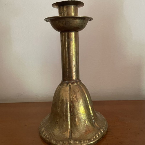 Handmade antique candlestick over 100 years old, brass with hammered details, used