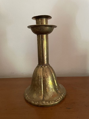 Handmade antique candlestick over 100 years old, brass with hammered details, used