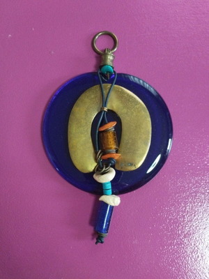 Evil eye charm made of blown glass with bronze horseshoe like new
