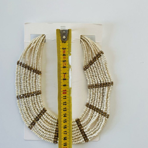 Wide necklace like new with beige and gold beads and metal details