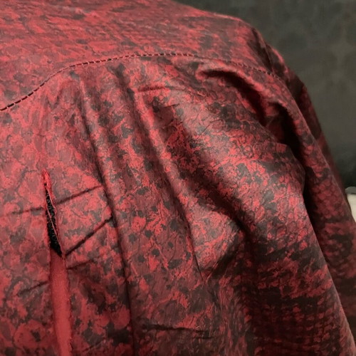 Nike snake print pants with signs of wear