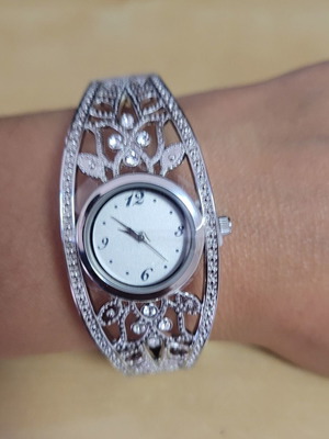 Avon bracelet watch like new, silver, needs new battery