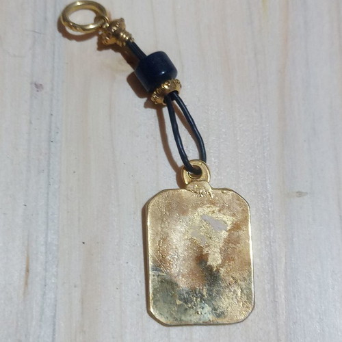 Saint Christopher keychain used, metallic gold color