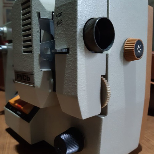Pycb film projector used, with leather case and 3 children's cartoons
