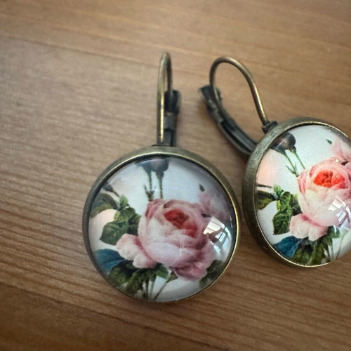 Earrings with rose like new