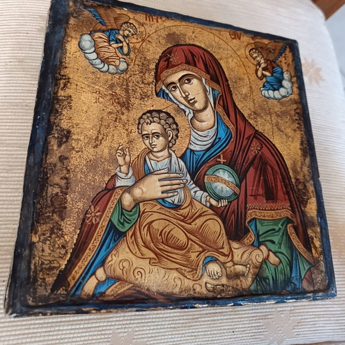 Cardboard box with silk-screened religious icon on canvas