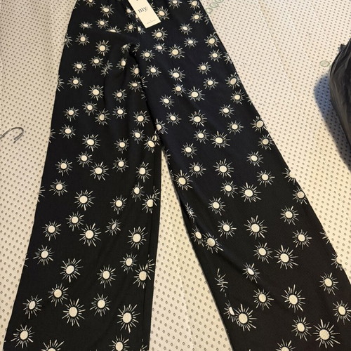 My Jewellerey pants size XS, black with white sun print
