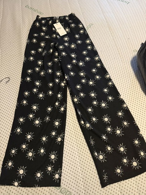 My Jewellerey pants size XS, black with white sun print