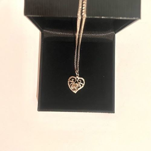 Silver necklace with heart used