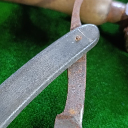 Vintage straight razors with leather strop and wooden handle