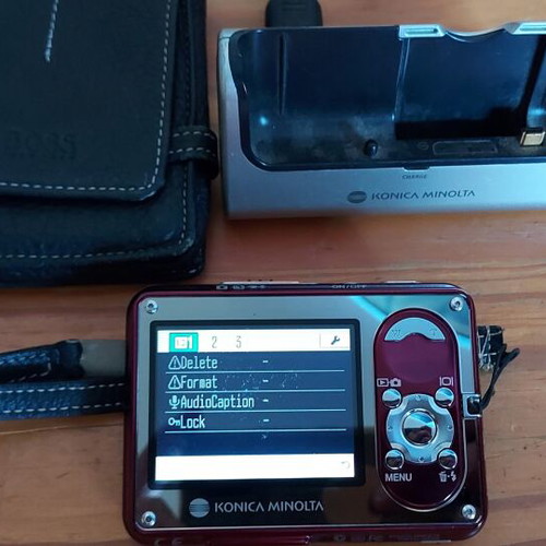 Konica Minolta DiMAGE X1 camera used, complete with charger and Boss strap