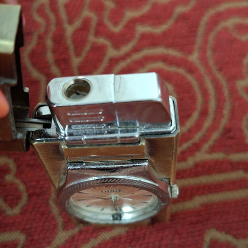 Vintage lighter with integrated quartz watch used