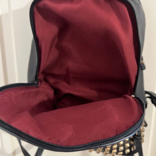 Black backpack used with studs