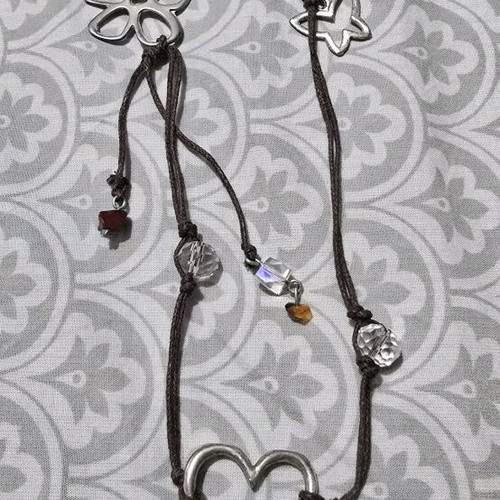 Necklace with beads and silver designs like new, brown and silver
