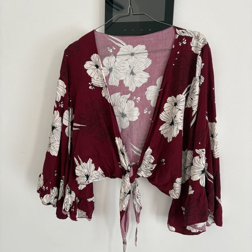 Floral shirt with sleeve openings