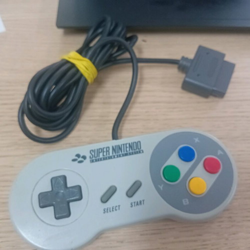 Super Nintendo 1990 console with 2 controllers and 3 games