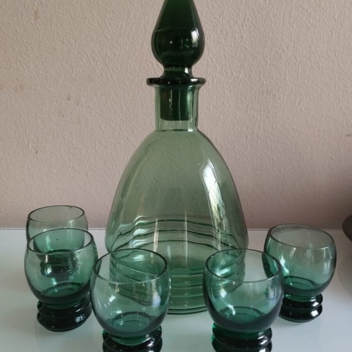 Vintage decanter set with 5 green glass shot glasses used