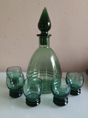 Vintage decanter set with 5 green glass shot glasses used