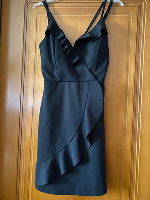 Black dress used with gold zipper on back